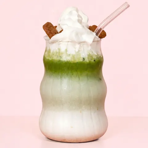 Biscoff Matcha at WEPE, Pererenan, Bali. Iced matcha latte crowned with cream and Biscoff biscuits