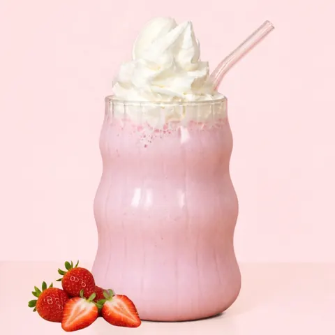 Strawberry Milkshake at WEPE, Pererenan, Bali. Pink strawberry milkshake under a swirl of whipped cream