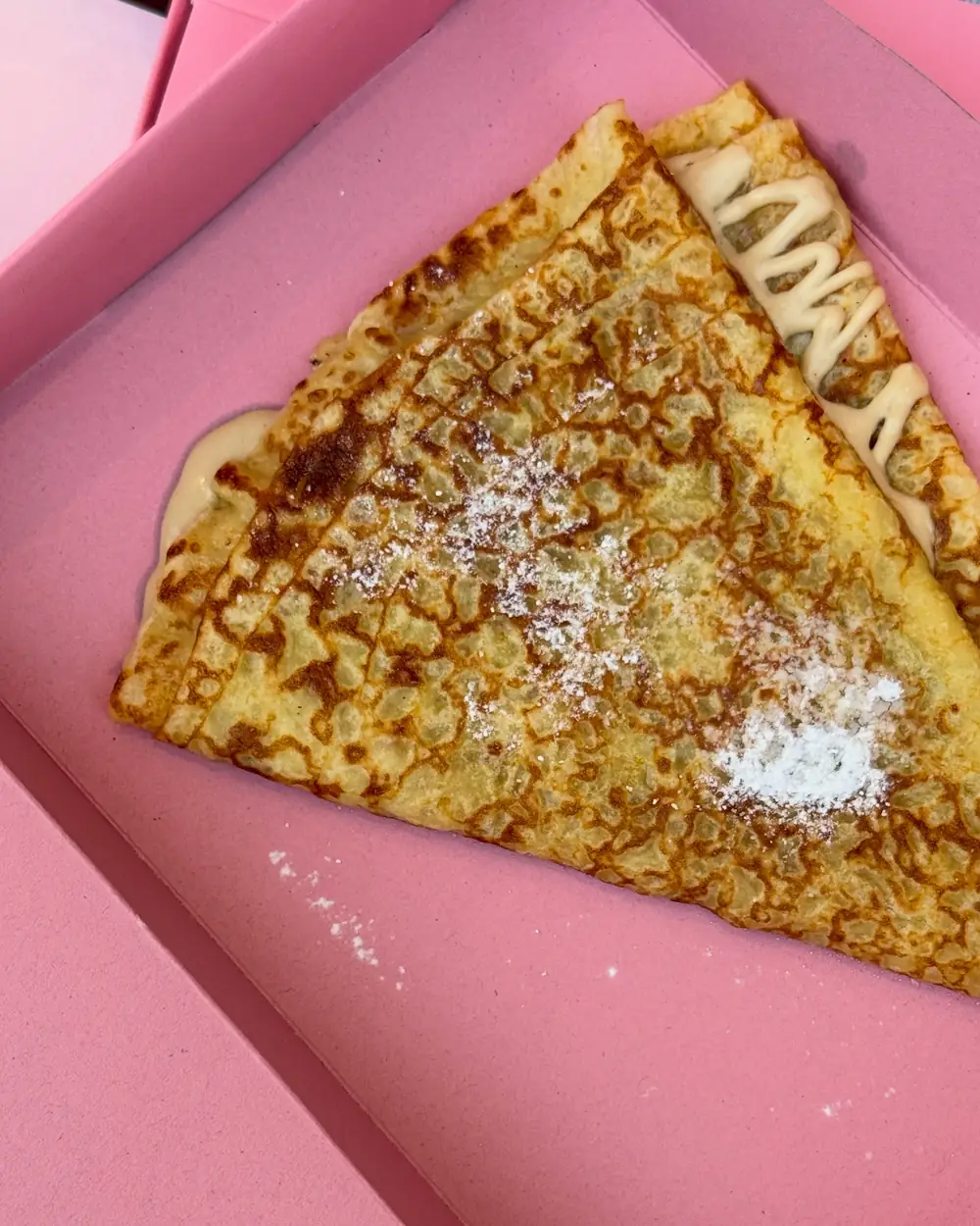WEPE crêpe dusted with icing sugar on a pink tray, Pererenan, Bali